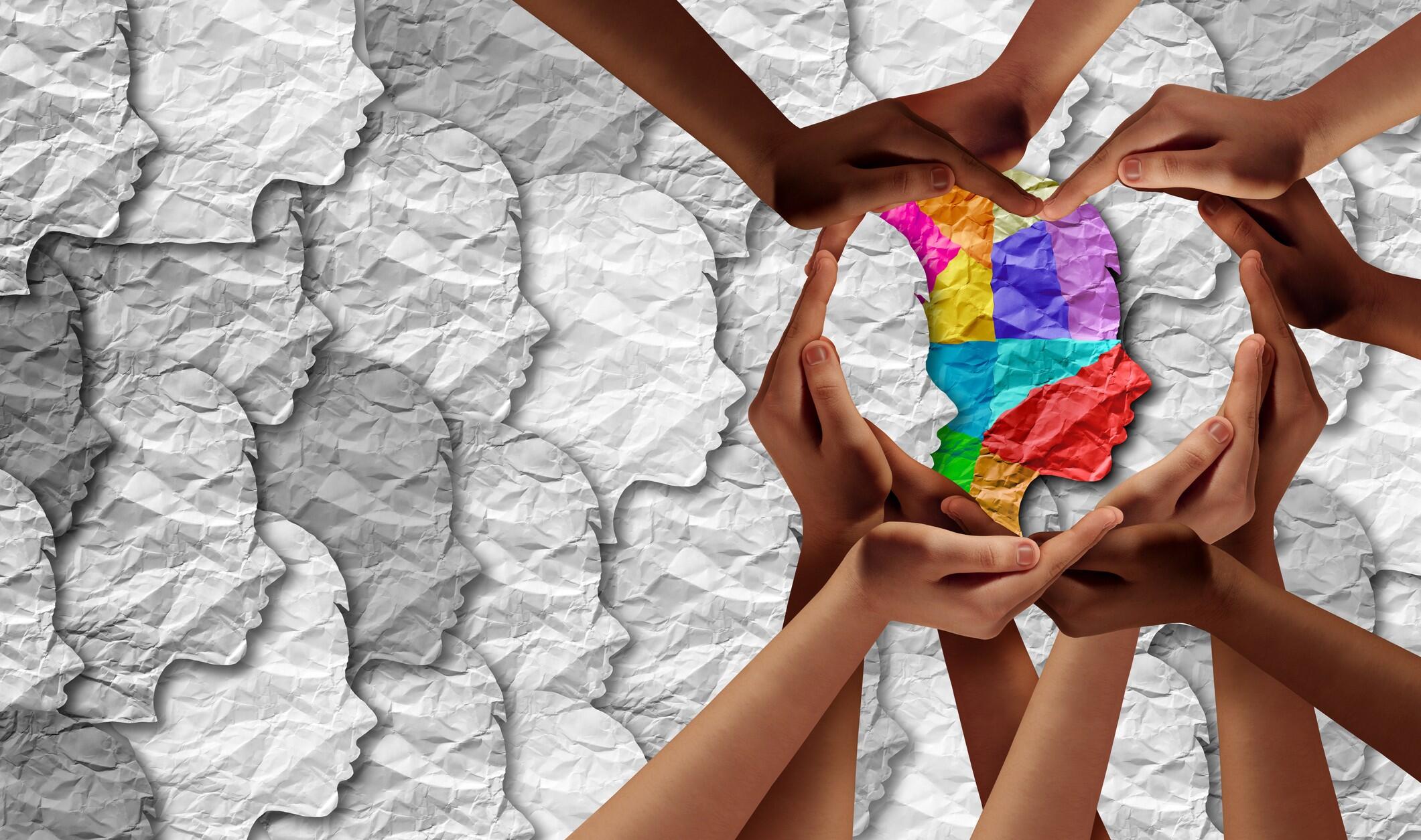Hands gathered around World Autism Awareness Day logo