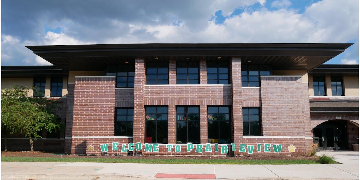 Front entrance of school with letters that say Welcome to Prairieview